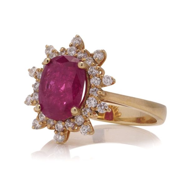 Ruby and diamond cluster ring in yellow gold.