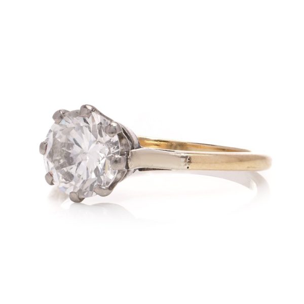 Diamond solitaire ring in gold and silver.