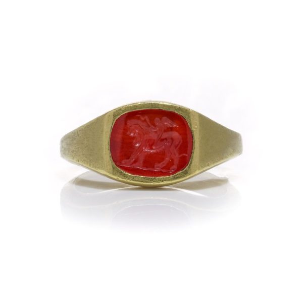 Antique Roman 22ct Gold Carnelian Intaglio Signet Ring, Roman intaglio carved from carnelian depicting Cupid riding a lion Mounted in a 19th century 22ct yellow gold shank