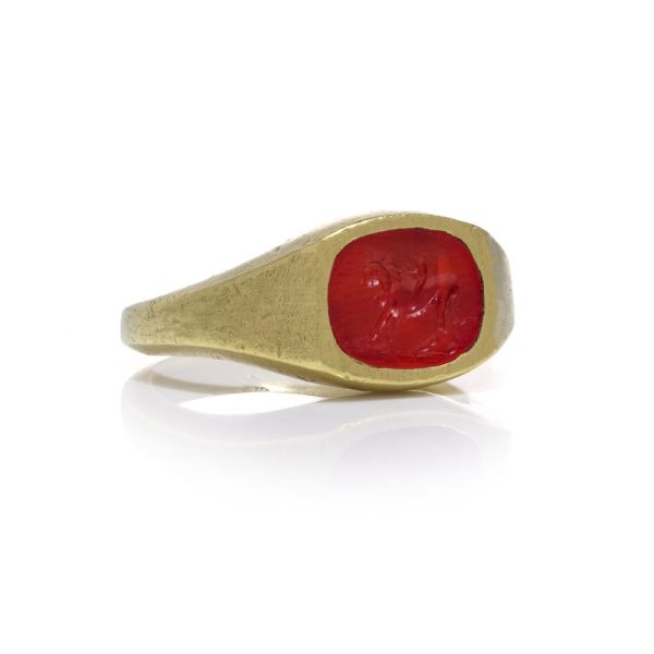 Antique Roman 22ct Gold Carnelian Intaglio Signet Ring, Roman intaglio carved from carnelian depicting Cupid riding a lion Mounted in a 19th century 22ct yellow gold shank