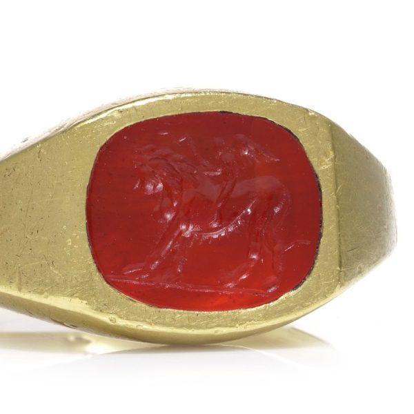 Antique Roman 22ct Gold Carnelian Intaglio Signet Ring, Roman intaglio carved from carnelian depicting Cupid riding a lion Mounted in a 19th century 22ct yellow gold shank