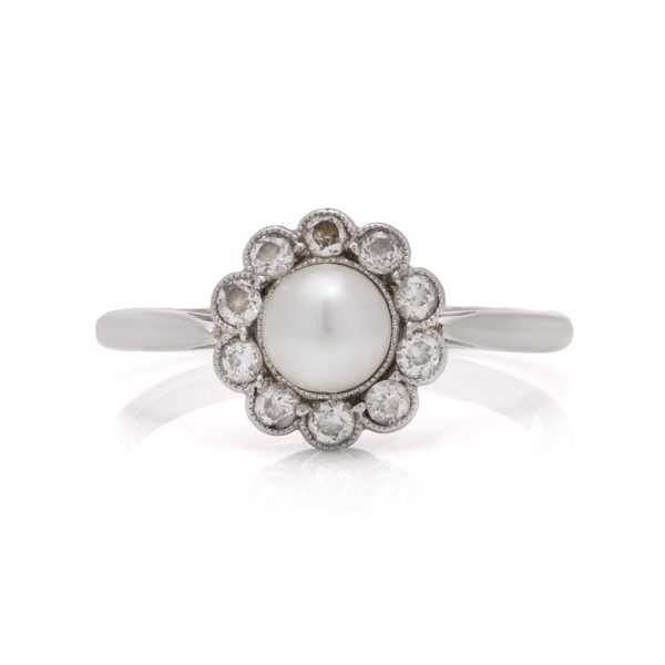 Diamond and pearl cluster ring in platinum and gold.