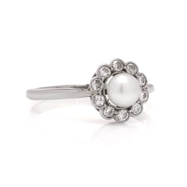 Diamond and pearl cluster ring in platinum and gold.