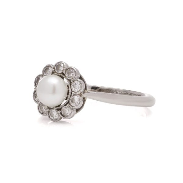 Diamond and pearl cluster ring in platinum and gold.