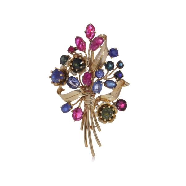 Multi coloured gem flower brooch in gold.