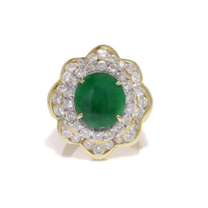 Jade and diamond cluster ring in gold.