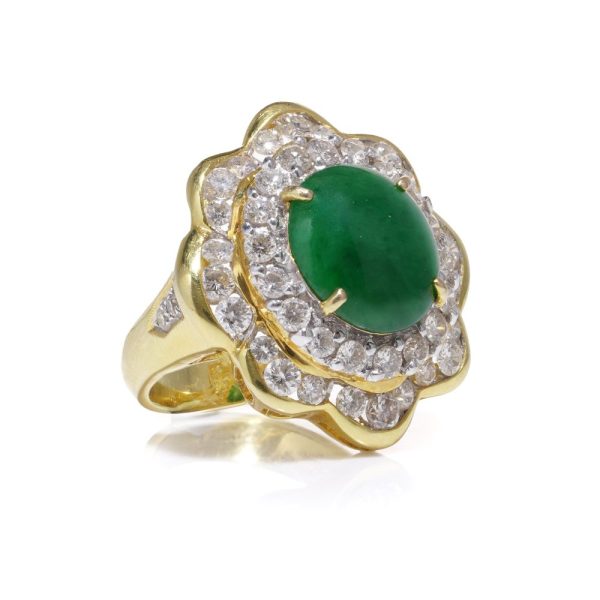 Jade and diamond cluster ring in gold.