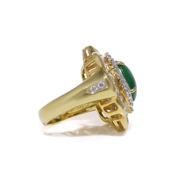 Jade and diamond cluster ring in gold.