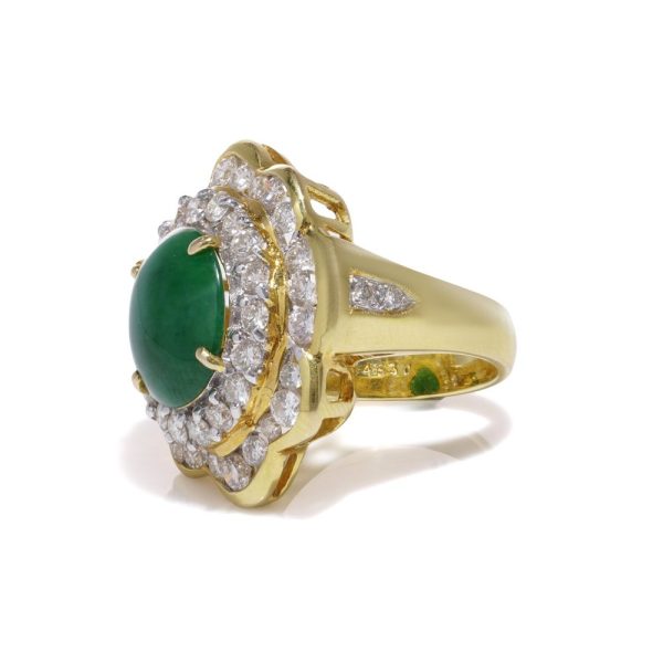 Jade and diamond cluster ring in gold.