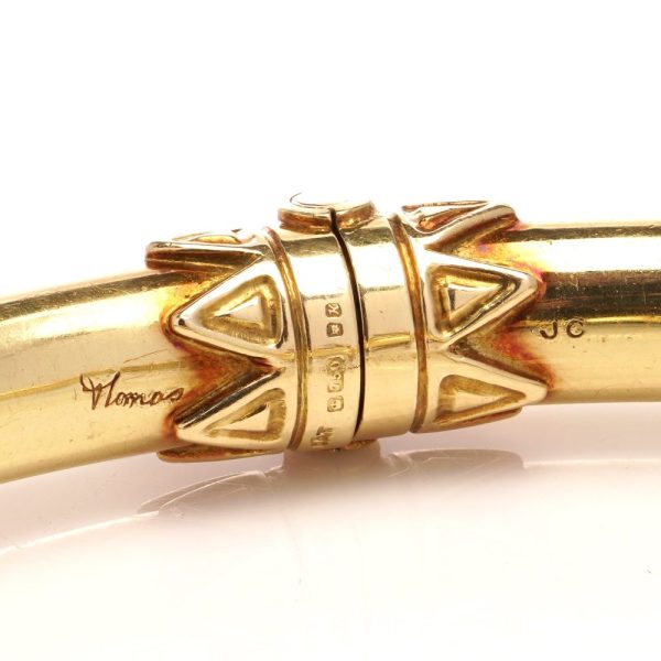 David Thomas head bangle in gold.