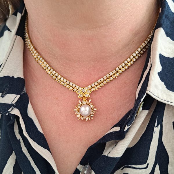 South Sea Pearl and Diamond Pendant Necklace, 10 carat total, 18ct yellow gold necklace set with double row of diamonds with central diamond cluster which suspends the detachable South Sea pearl and baguette-cut diamond cluster pendant drop