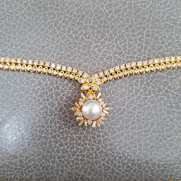 South Sea Pearl and Diamond Pendant Necklace, 10 carat total, 18ct yellow gold necklace set with double row of diamonds with central diamond cluster which suspends the detachable South Sea pearl and baguette-cut diamond cluster pendant drop