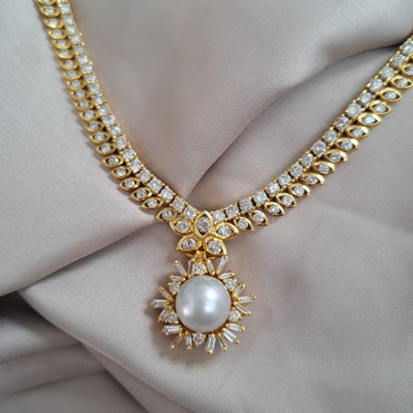 South Sea Pearl and Diamond Pendant Necklace, 10 carat total, 18ct yellow gold necklace set with double row of diamonds with central diamond cluster which suspends the detachable South Sea pearl and baguette-cut diamond cluster pendant drop