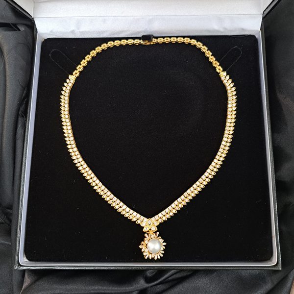 South Sea Pearl and Diamond Pendant Necklace, 10 carat total, 18ct yellow gold necklace set with double row of diamonds with central diamond cluster which suspends the detachable South Sea pearl and baguette-cut diamond cluster pendant drop