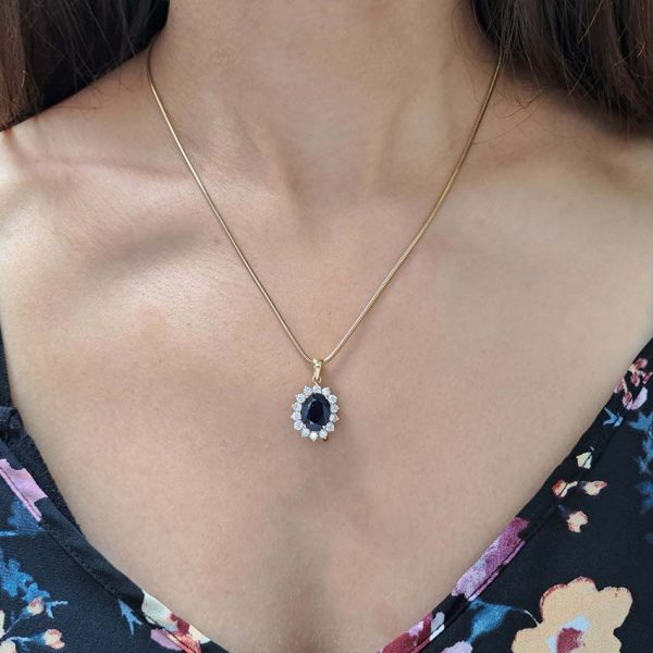 Vintage 3ct Sapphire and Diamond Oval Cluster Pendant with Chain, 3ct oval-cut blue sapphire surrounded by 1.40 carats sparkling diamonds on 18ct yellow gold snake chain