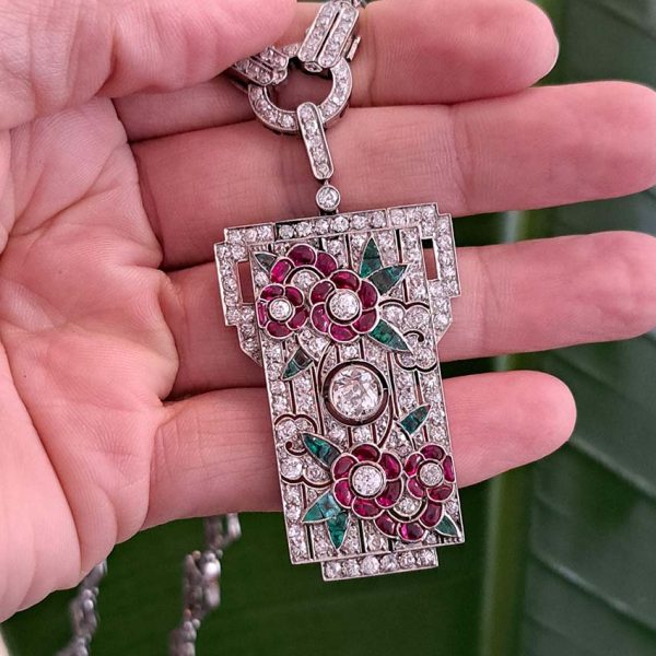 Art Deco Ruby Emerald Diamond Pendant Sautoir Necklace in Platinum, diamond sautoir necklace of alternating sized diamond-shaped links set with single-cut diamonds leading to detachable diamond, ruby and emerald set floral plaque pendant. Circa 1925