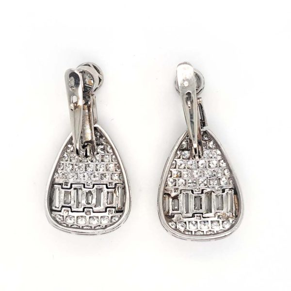 Late Art Deco 5ct Diamond Drop Earrings, old cut diamond solitaire tops suspend pear shaped drops with baguette-cut diamond bands in 18ct white gold