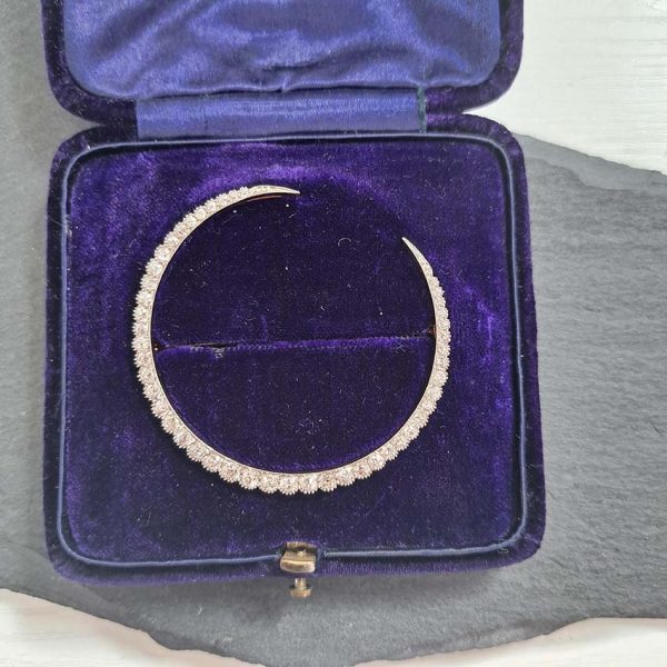 Antique Old Mine Cut Diamond Crescent Moon Brooch set with graduating old mine-cut diamonds in platinum and 14ct gold