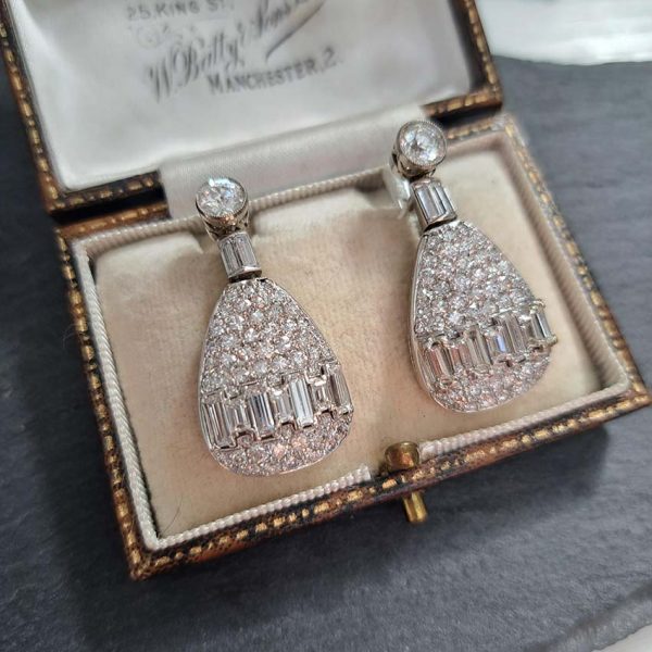 Late Art Deco 5ct Diamond Drop Earrings, old cut diamond solitaire tops suspend pear shaped drops with baguette-cut diamond bands in 18ct white gold