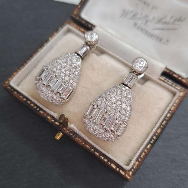 Late Art Deco 5ct Diamond Drop Earrings, old cut diamond solitaire tops suspend pear shaped drops with baguette-cut diamond bands in 18ct white gold