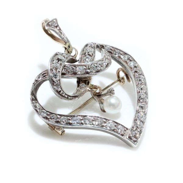 Heart brooch/pendant with old cut diamonds in gold and silver.