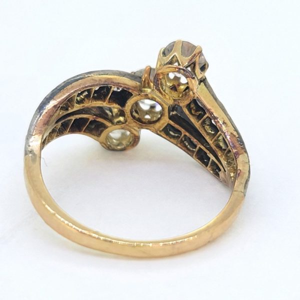 Victorian Antique Diamond Three Stone Banded Ring, diamond trilogy vertically set in asymmetrical design flanked by diamond banded shoulders in silver upon 18ct yellow gold