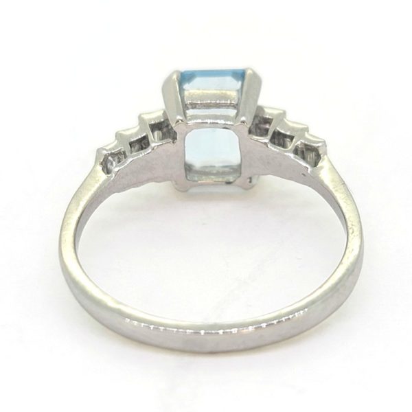 1.20ct Aquamarine and Diamond Engagement Ring in Platinum, 1.20ct emerald-cut aquamarine flanked by graduated stepped baguette-cut diamonds to the sides