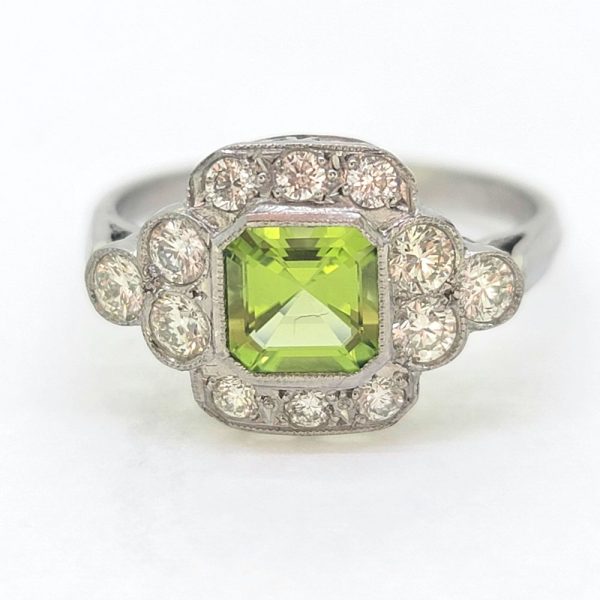 Peridot and Diamond Cluster Engagement Ring in Platinum, 0.90ct octagonal step-cut peridot surrounded by a border of sparkling round brilliant-cut diamonds