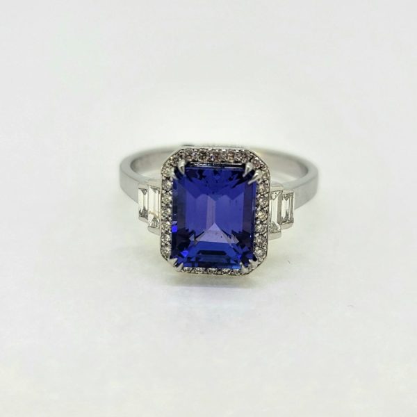 2ct Emerald Cut Tanzanite and Diamond Cluster Engagement Ring in Platinum with Baguette Diamond Shoulders