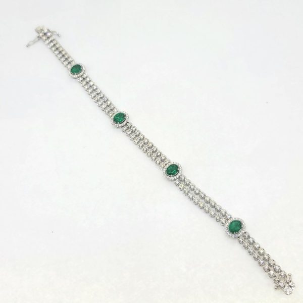 2.24ct Emerald and 3.45ct Diamond Bracelet, double row of sparkling diamonds interspersed with emerald and diamond cluster accents in 18ct white gold