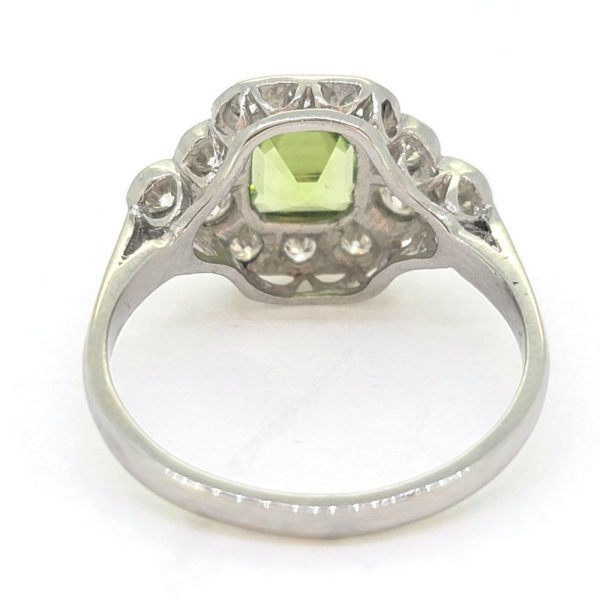 Peridot and Diamond Cluster Engagement Ring in Platinum, 0.90ct octagonal step-cut peridot surrounded by a border of sparkling round brilliant-cut diamonds