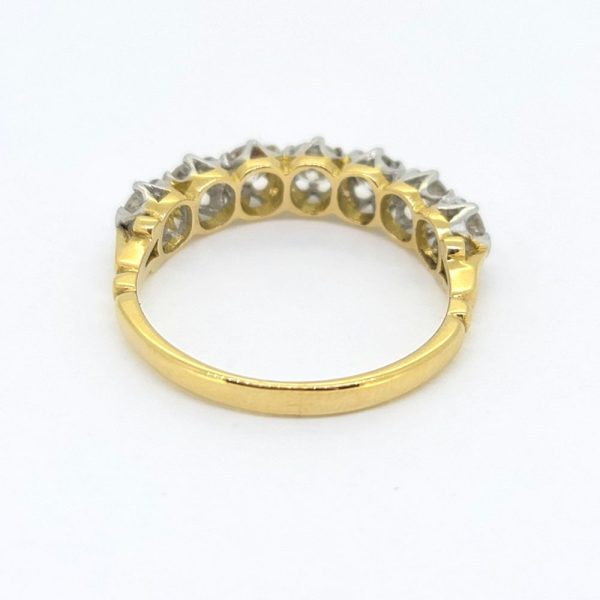 1ct Diamond Seven Stone Half Eternity Ring, 18ct yellow gold ring set with seven round brilliant-cut diamonds in a modern half eternity band ring design