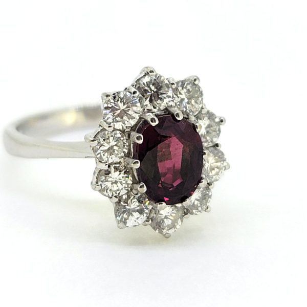 Natural No Heat Ruby and Diamond Cluster Engagement Ring, oval-cut Thai ruby with no indication of heat treatment surrounded by 1ct sparkling round brilliant-cut diamonds in 18ct white gold