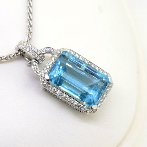 30ct Aquamarine and Diamond Cluster Pendant with Chain, large 30 carat emerald-cut aquamarine surrounded by a sparkling diamond border on a large link chain via diamond-set bail