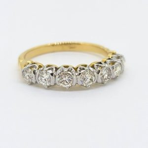 1ct Diamond Seven Stone Half Eternity Ring, 18ct yellow gold ring set with seven round brilliant-cut diamonds in a modern half eternity band ring design