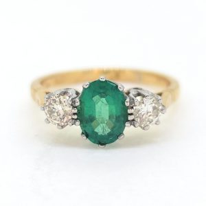 1.10ct Oval Emerald and Diamond Three Stone Engagement Ring