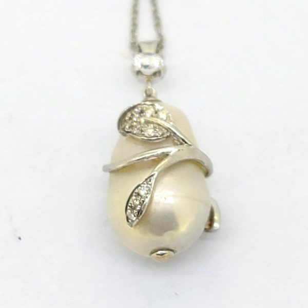 Southsea Pearl and Diamond Pendant with Chain, cultured South Sea pearl with 18ct white gold leaf wrap around design set with sparkling diamonds