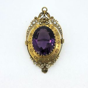 Victorian Antique Amethyst and 15ct Gold Etruscan Brooch with detailed pearl top edge, Secured by a single pin