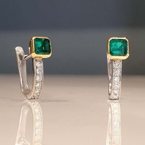 Vintage Emerald and Diamond Hoop Earrings, set with octagonal step-cut emeralds and round brilliant-cut diamonds with hinged post fittings