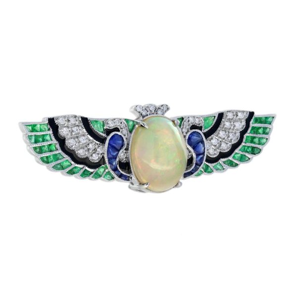 4.51ct Oval Cabochon Ethiopian Opal Emerald Sapphire and Diamond Wing Brooch with Black Enamel in 18ct White Gold