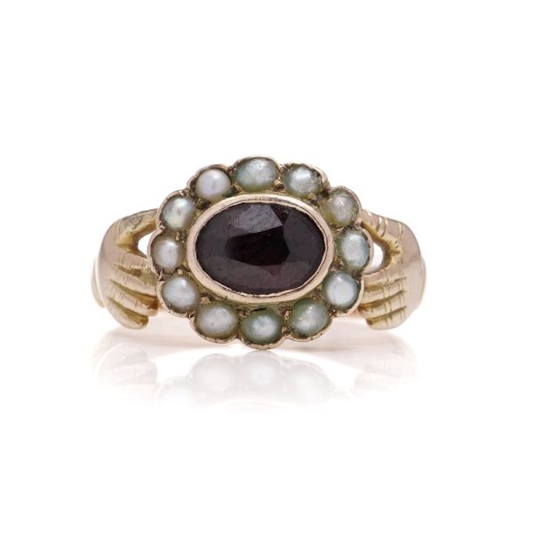 Fede ring in gold and set with garnet and seed pearls.