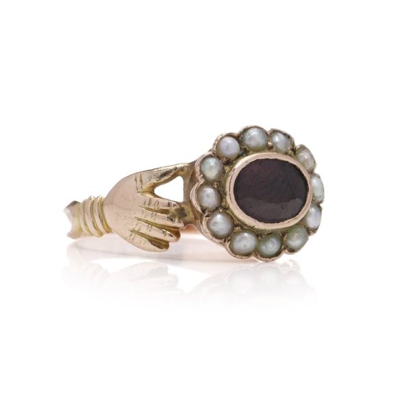 Fede ring in gold and set with garnet and seed pearls.