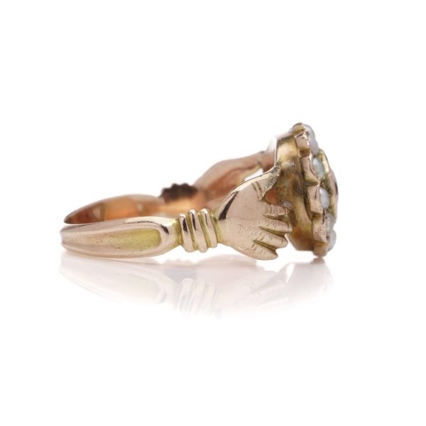 Fede ring in gold and set with garnet and seed pearls.