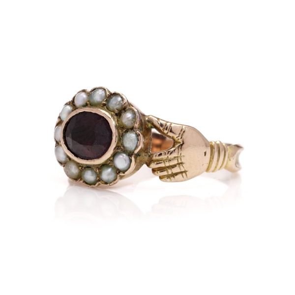 Fede ring in gold and set with garnet and seed pearls.