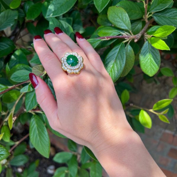 Jade and diamond cluster ring in gold.