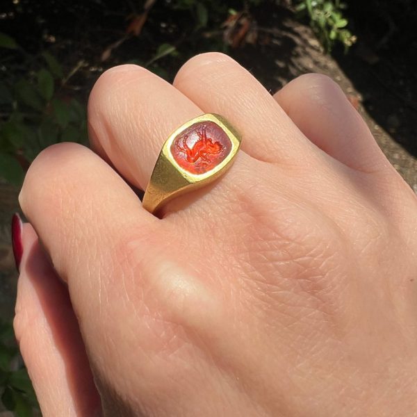 Antique Roman 22ct Gold Carnelian Intaglio Signet Ring, Roman intaglio carved from carnelian depicting Cupid riding a lion Mounted in a 19th century 22ct yellow gold shank