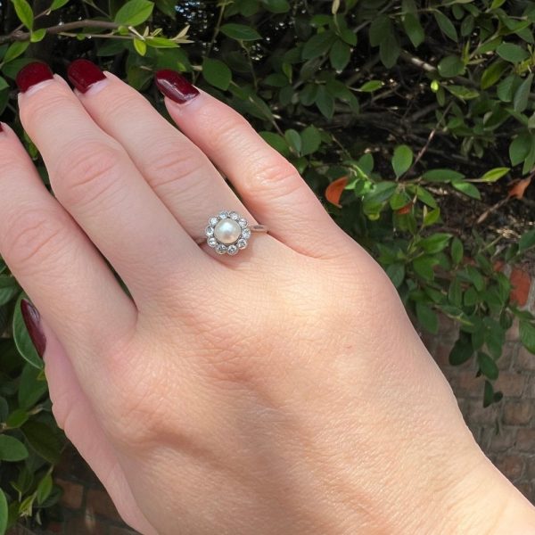 Diamond and pearl cluster ring in platinum and gold.