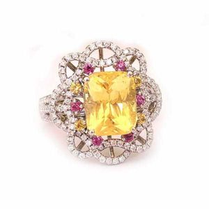 5.08ct Natural No Heat Yellow Sapphire Cluster Ring, cushion-shaped mixed-cut certified natural yellow sapphire with no indications of heat treatment surrounded by diamonds with yellow and pink sapphire accents in a contemporary flower design in platinum