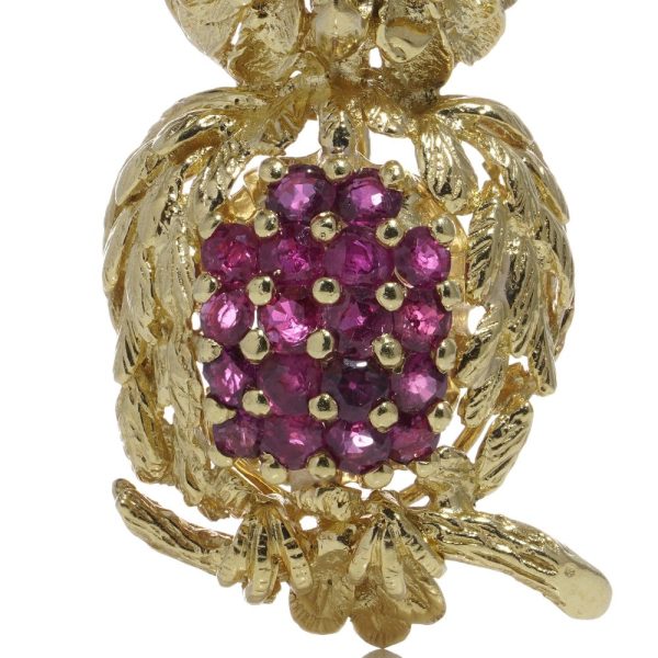 Vintage owl brooch with rubies and sapphires in gold.