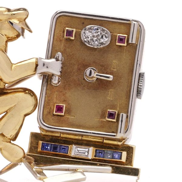 Vintage Gold Jewelled Safe Cracker Lapel Brooch with Watch, designed as a safe cracker set with diamonds, rubies and sapphires